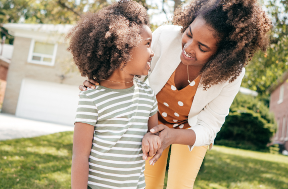 A woman and daughter smiling