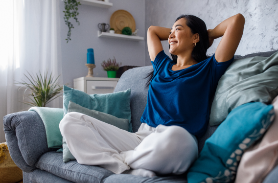 A woman relaxing in       her bed